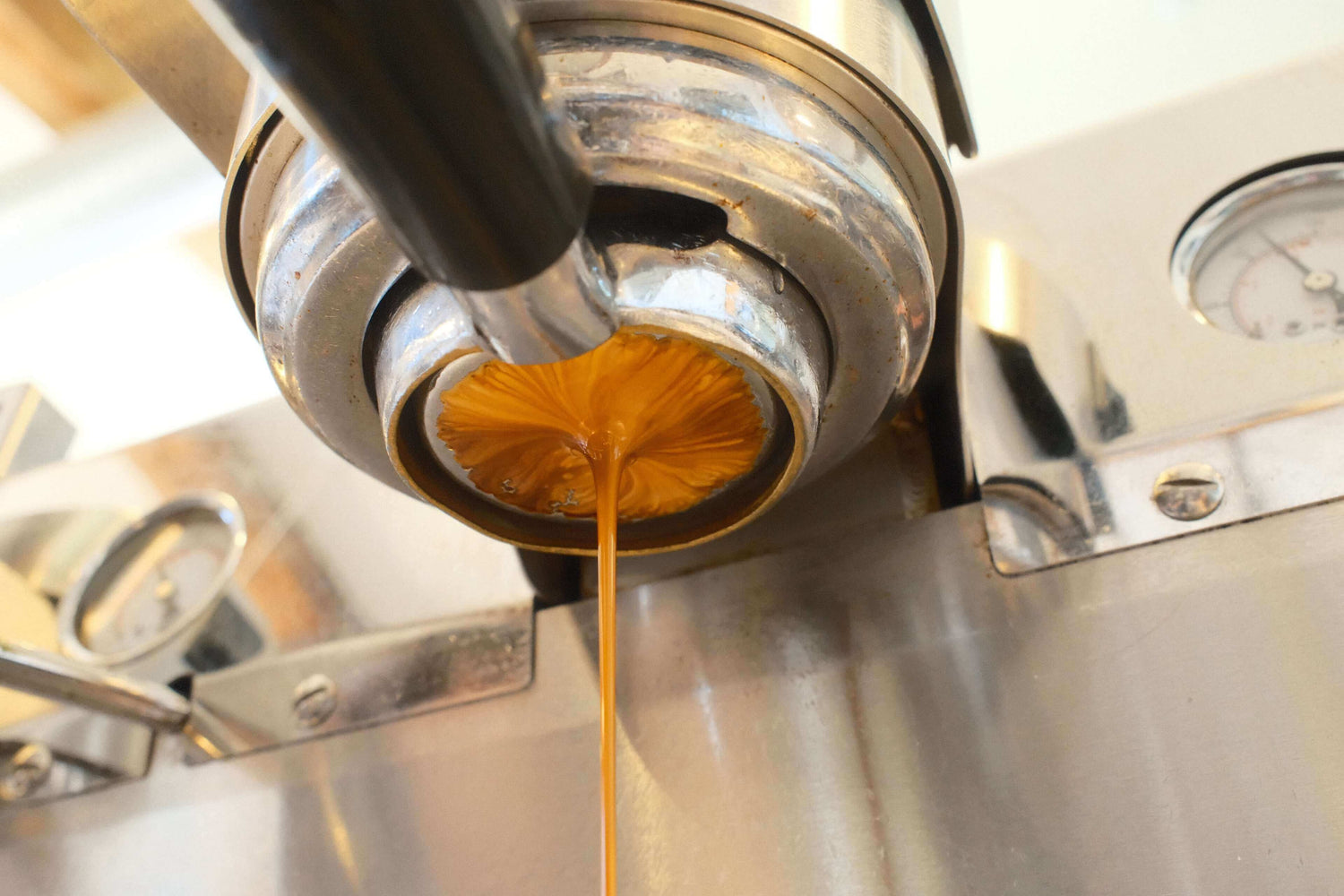 Best Beans For Espresso. A shot of espresso being poured from an espresso machine. Learn about how to make espresso. 